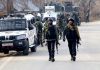Security personnel during an encounter at Chowgam in Shopian on Saturday. (UNI)