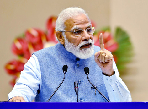 Prime Minister Narendra Modi addressing at a function on “Depositors First: Guaranteed Time-bound Deposit Insurance Payment up to Rs 5 Lakh” in New Delhi on Sunday.