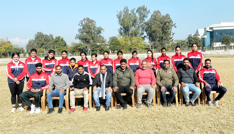 Selected players posing for a group photograph with officials of University of Jammu on Wednesday.