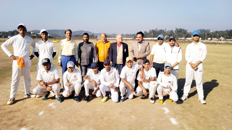 Winning team posing for a group photograph with dignitaries at Khel Gaon Nagrota.