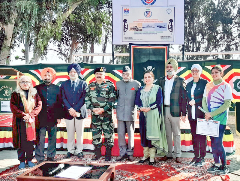 Veer Naris along with PVC Capt Bana Singh and Army officials posing for a group photograph during a function at village Simbal on Thursday.