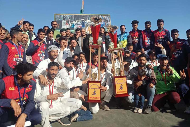 Winners posing for group photograph by holding trophies at Mendhar on Wednesday.