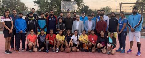 Selected men and women Basketball teams posing for a group photograph along with Divisional Sports Officer Ashok Singh and others at Jammu. Selected men and women Basketball teams posing for a group photograph along with Divisional Sports Officer Ashok Singh and others at Jammu.