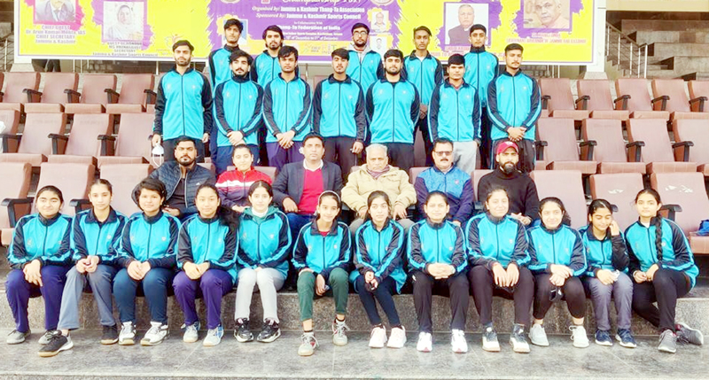 Fencers posing for a group photograph along with Divisional Sports Officer Ashok Singh and others at MA Stadium Jammu.