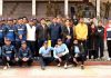 Div Com Raghav Langer and others posing for a group photograph during a friendly match at MA Stadium, Jammu.