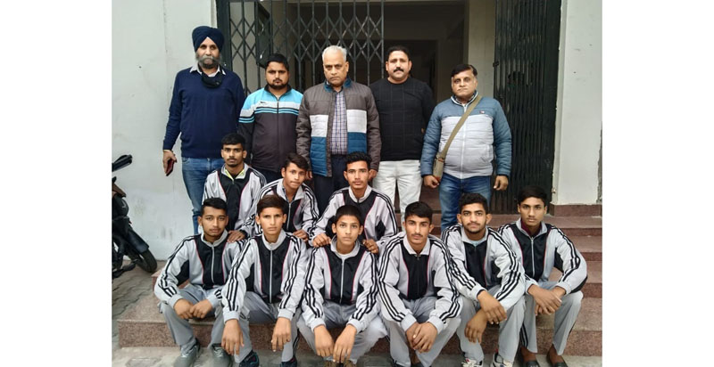 Selected wrestlers posing for a group photograph with Divisional Sports Officer Jammu, Ashok Singh on Wednesday.