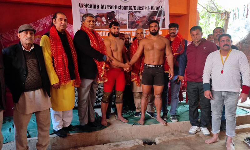Dignitaries introducing wrestlers during Freestyle Wrestling Championship in Jammu on Wednesday.