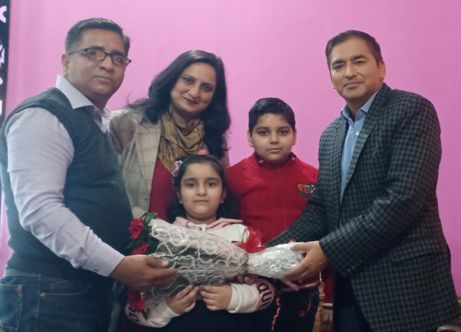 President J&K Chess Association, Atul Gupta presenting a bouquet to Alankrita at Jammu on Friday.