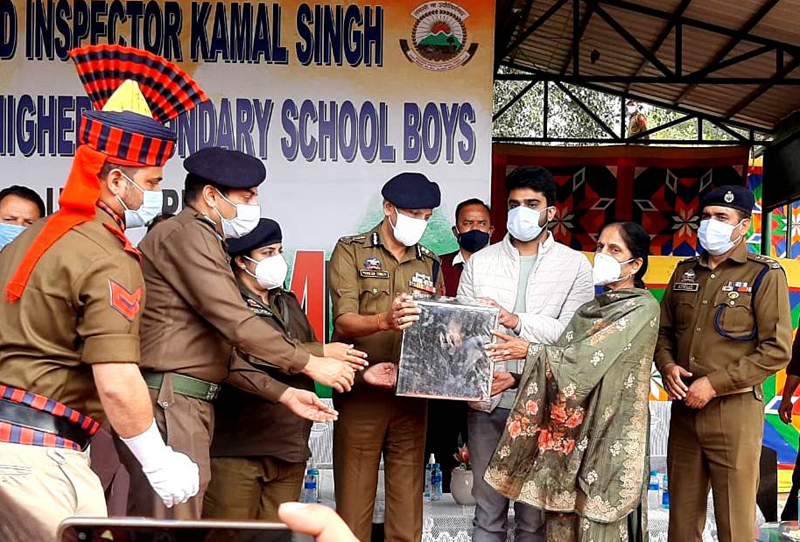 ADGP Jammu Mukesh Singh presenting a memento to family members of martyr Kamal Singh.