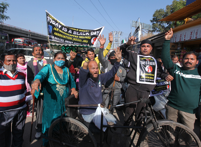 Persons with disabilities staging protest near Press Club, Jammu on Friday. - Excelsior/Rakesh Persons with disabilities staging protest near Press Club, Jammu on Friday. - Excelsior/Rakesh