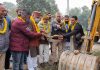 Bharat Bhushan Bodhi and others formally launching road upgradation work in Marh on Sunday.
