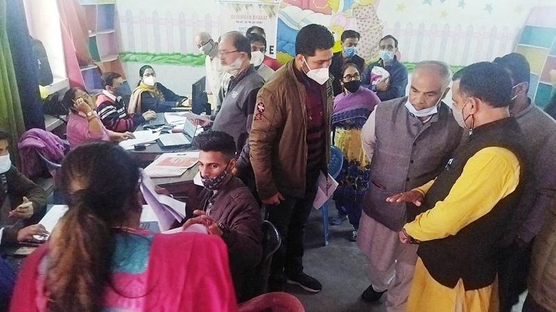 BJP general secretary (Org), Ashok Kaul and councilor, Sanjay Baru interacting with officials at Ayushman camp held at Bohri on Thursday.