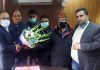 Ware House Traders presenting bouquet to VC JDA Pankaj Magotra.