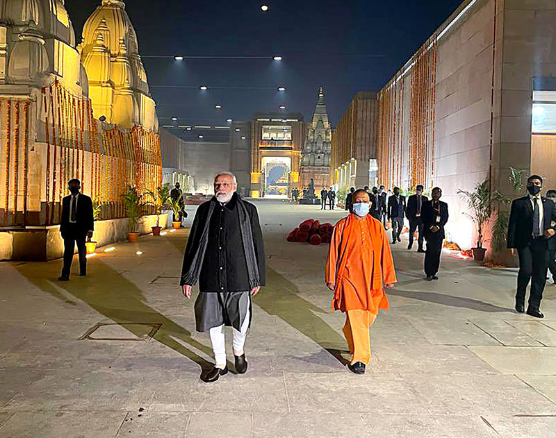 Prime Minister Narendra Modi and Uttar Pradesh Chief Minister Yogi Adityanath inspecting development works Kashi Vishwanath Corridor, in Varanasi on Monday night. (UNI) Prime Minister Narendra Modi and Uttar Pradesh Chief Minister Yogi Adityanath inspecting development works Kashi Vishwanath Corridor, in Varanasi on Monday night. (UNI)