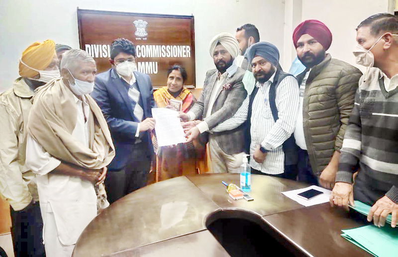 DDC Member, Suchetgarh, Taranjit Singh Tony along with other members of the delegation submitting a memorandum to Divisional Commissioner, Jammu, Dr Raghav Langer on Friday. DDC Member, Suchetgarh, Taranjit Singh Tony along with other members of the delegation submitting a memorandum to Divisional Commissioner, Jammu, Dr Raghav Langer on Friday.