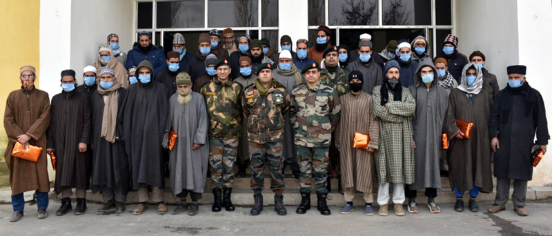 Army personnel and Moulvies posing for group photograph. Army personnel and Moulvies posing for group photograph.