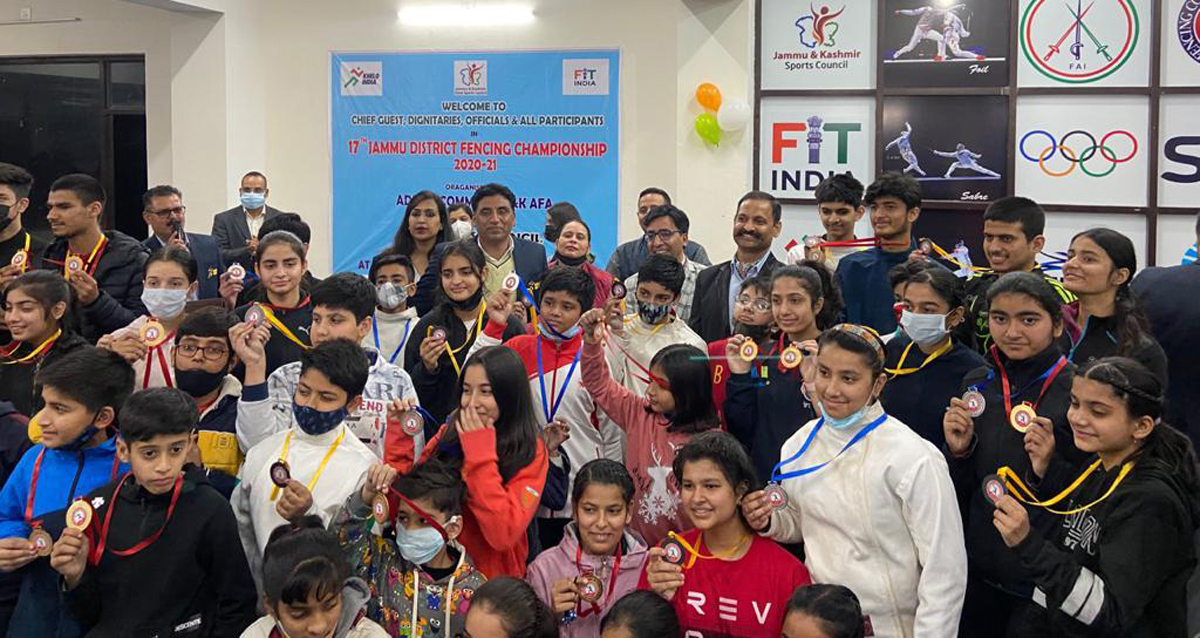 Winners displaying medals while posing with dignitaries at MA Stadium Jammu. Winners displaying medals while posing with dignitaries at MA Stadium Jammu.