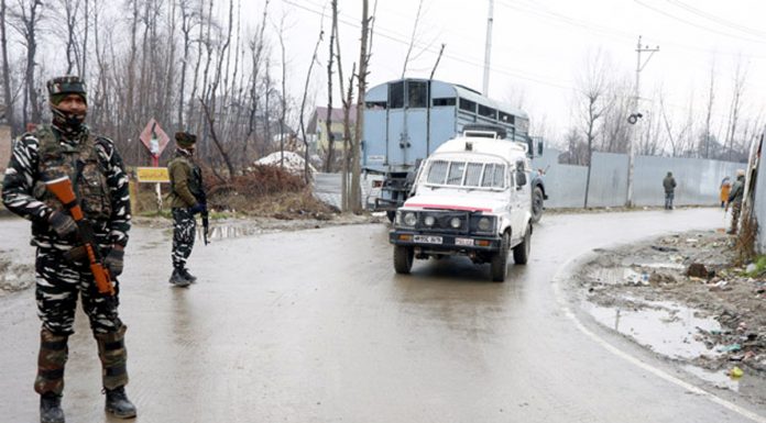 Security forces stand guard near encounter site at Chadoora in Budgam. —Excelsior/Shakeel