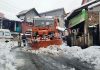 Snow clearance work in progress at Gandoh town in Doda district on Monday. -Excelsior/Rafi Choudhary