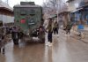 Security forces near encounter site at Chandgam in Pulwama on Wednesday. —Excelsior/Younis Khaliq