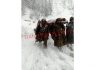 Army rescues an ailing woman at Ghaggar in Boniyar area of Uri. -ExcelsiorAbid Nabi