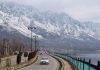 A view of Foreshore road with snow-topped mountains in the backdrop, in Srinagar. — Excelsior/Shakeel