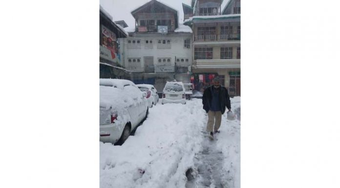 A view of snow clad Seri Bazar at Bhaderwah on Sunday. -Excelsior/Tilak Raj