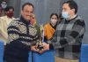 Director Information Rahul Pandey handing over trophy to Gagan Singh Jamwal at Jammu on Monday.