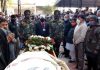 Army jawans and people paying tributes to veteran RSS leader, Brig Suchet Singh at Shastri Nagar Cremation ground on Friday.
