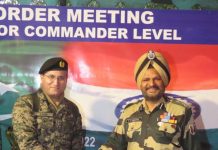 BSF Jammu Frontier and Pakistan Rangers officers attending a Sector Commander level meeting at Octroi post in Suchetgarh sector of Jammu on Wednesday. (UNI)