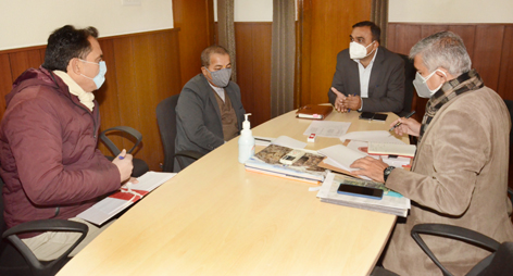 CEO Ramesh Kumar chairing a meeting.