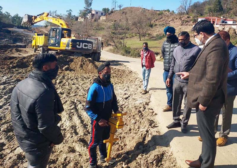 Dy Commissioner Rajouri, Vikas Kundal inspecting progress of work on Jammu-Poonch highway near Sunderbani on Friday. Dy Commissioner Rajouri, Vikas Kundal inspecting progress of work on Jammu-Poonch highway near Sunderbani on Friday.