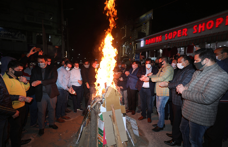 People celebrating Lohri outside Raghunath Mandir in Jammu on Thursday. — Excelsior/Rakesh