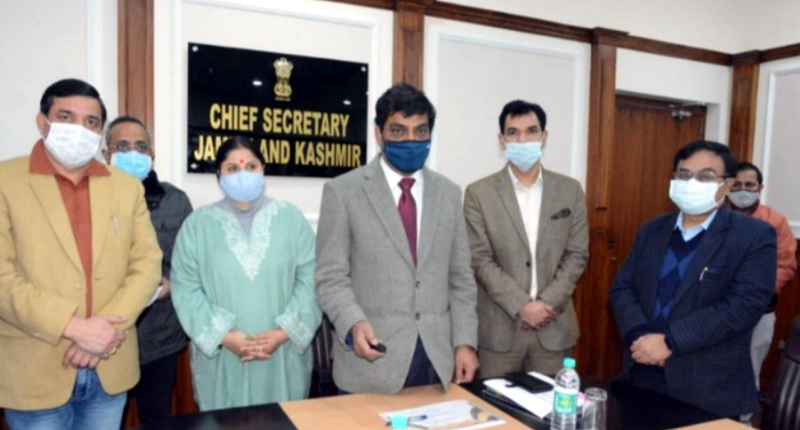 Chief Secy Dr A K Mehta handing over trilingual land pass books to farmers. Chief Secy Dr A K Mehta handing over trilingual land pass books to farmers.