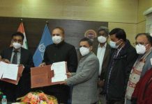 Representatives of IGNOU and MSDE displaying copies of MoU signed between them.