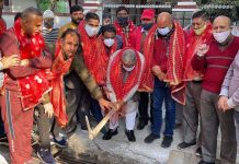 BJP senior leader Sat Sharma and party vice president Yudhvir Sethi kick starting construction of lane in Jammu on Friday.