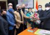 Office bearers of Raghunath Bazar Businessmen Association presenting bouquet to Divisional Commissioner Jammu Dr Raghav Langar.
