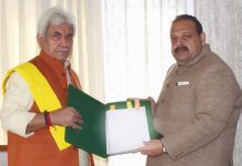 Lt Governor receiving memorandum from BJP leader Devender Singh Rana.