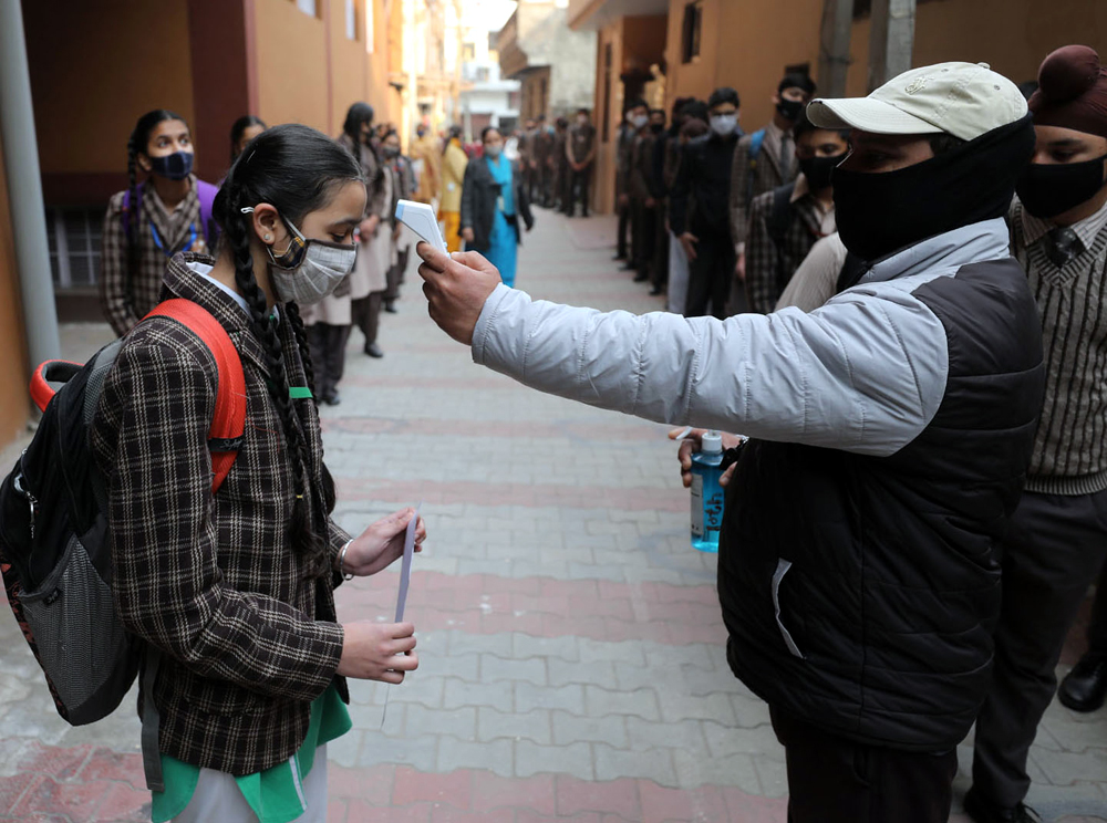 Students undergoing screening on entering the school premises on Monday. —Excelsior/Rakesh