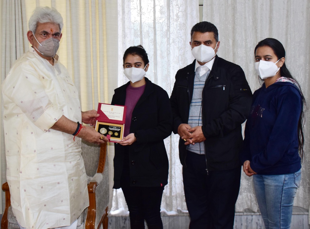 Lt Governor felicitating Ms Arushi Kotwal