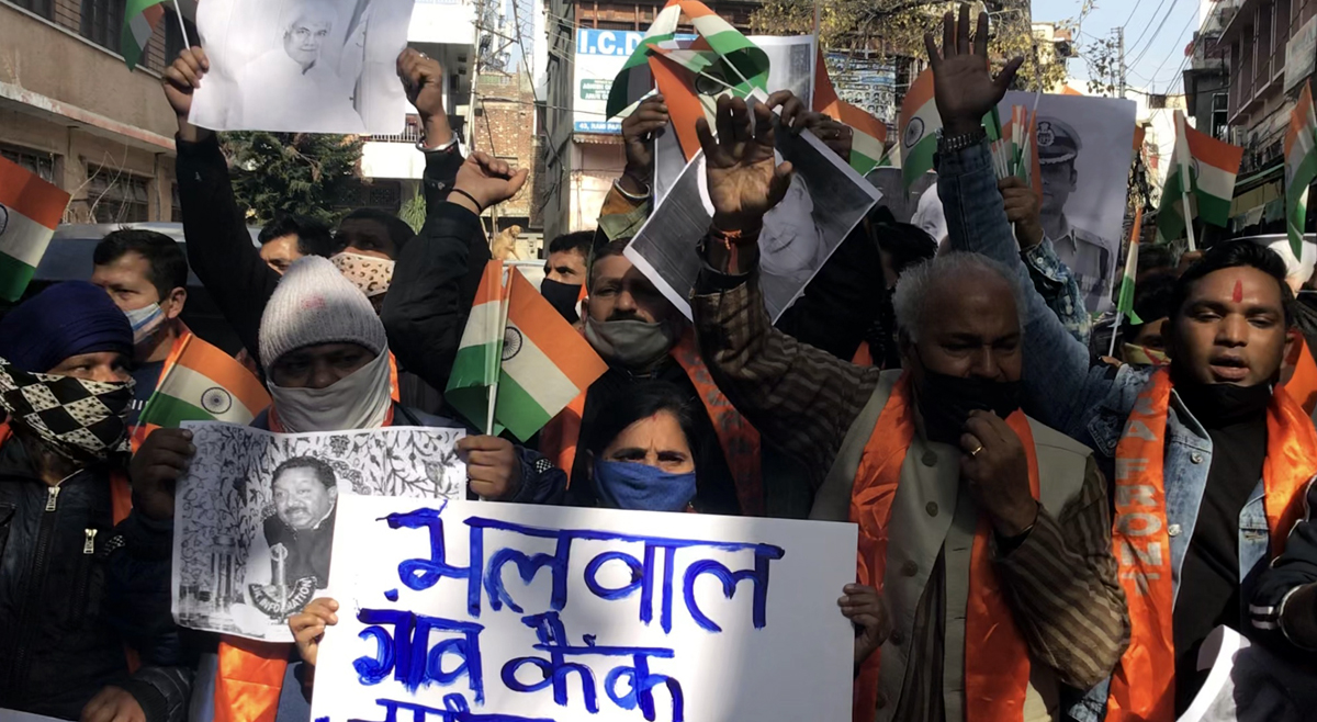 Workers of Dogra Front & Shiv Sena raising slogans during a protest in Jammu on Monday. Workers of Dogra Front & Shiv Sena raising slogans during a protest in Jammu on Monday.
