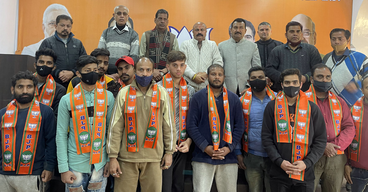 BJP leaders taking new entrants in party fold at Jammu on Monday. BJP leaders taking new entrants in party fold at Jammu on Monday.