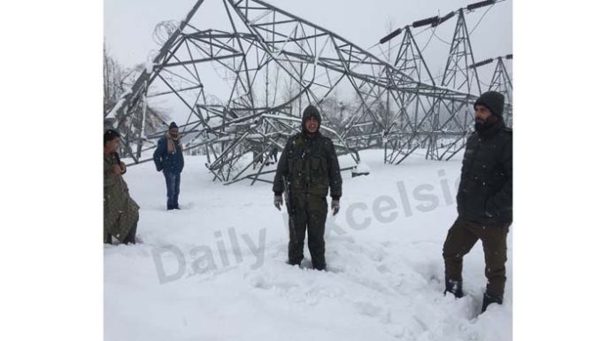 Towers of 132 KV Mirbazar Kulgam transmission line feeding Grid Station collapses due to heavy snowfall in Kulgam district of South Kashmir. -Excelsior/Sajjad Dar