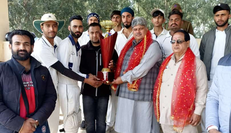 Winning trophy being presented to players by dignitaries at Smailpur on Monday.