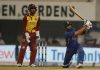 Virat Kohli playing a shot during his knock of fifty against West Indies at Kolkata.