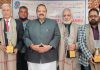 BJP leader Devender Singh Rana alongwith Sahitya Akademi awardees posing for a group photograph.