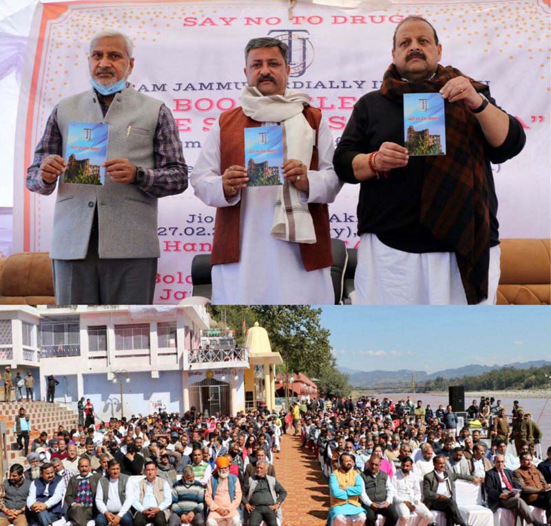 Sham Lal along with Devender Rana join Zorawar Singh in releasing book of Dogri poems against drug abuse at Akhnoor on Sunday.
