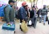 Polling officials carrying the Electronic Voting Machine (EVMs) and other necessary inputs required for the Punjab Assembly Election, at a distribution centre, in Amritsar, Punjab on Saturday. (UNI)