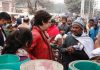 Congress leader Priyanka Gandhi Vadra interacting with people during her door-to-door campaign at Khair in Aligarh on Saturday. (UNI)