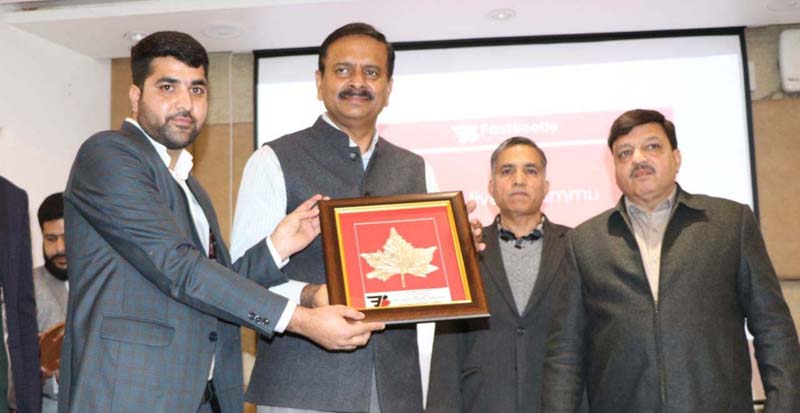 page7-4 CEO of FastBeetle Sheikh Samiullah presenting a souvenir to Principal Secretary, Industries and Commerce at Jammu.